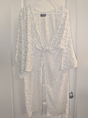 PARALLEL LINES Longline Blouse with Twist Front Detail in Abstract Print